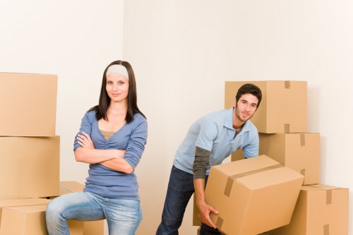 Movers handling office equipment during a Blackfriars same day move