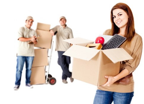 Trained movers handling boxes with care during a relocation