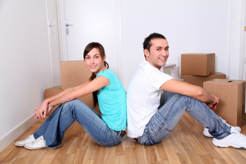Moving team assisting with furniture transport in Blackfriars