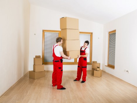 Mover wearing PPE and checking safety measures before work